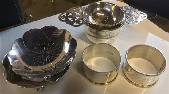 Two silver lotus dishes, 2 napkin rings and a tea strainer